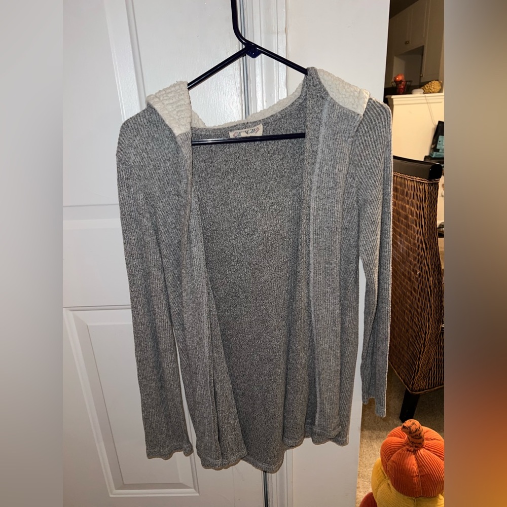 Woman’s medium grey cover up sweater with hood and pockets